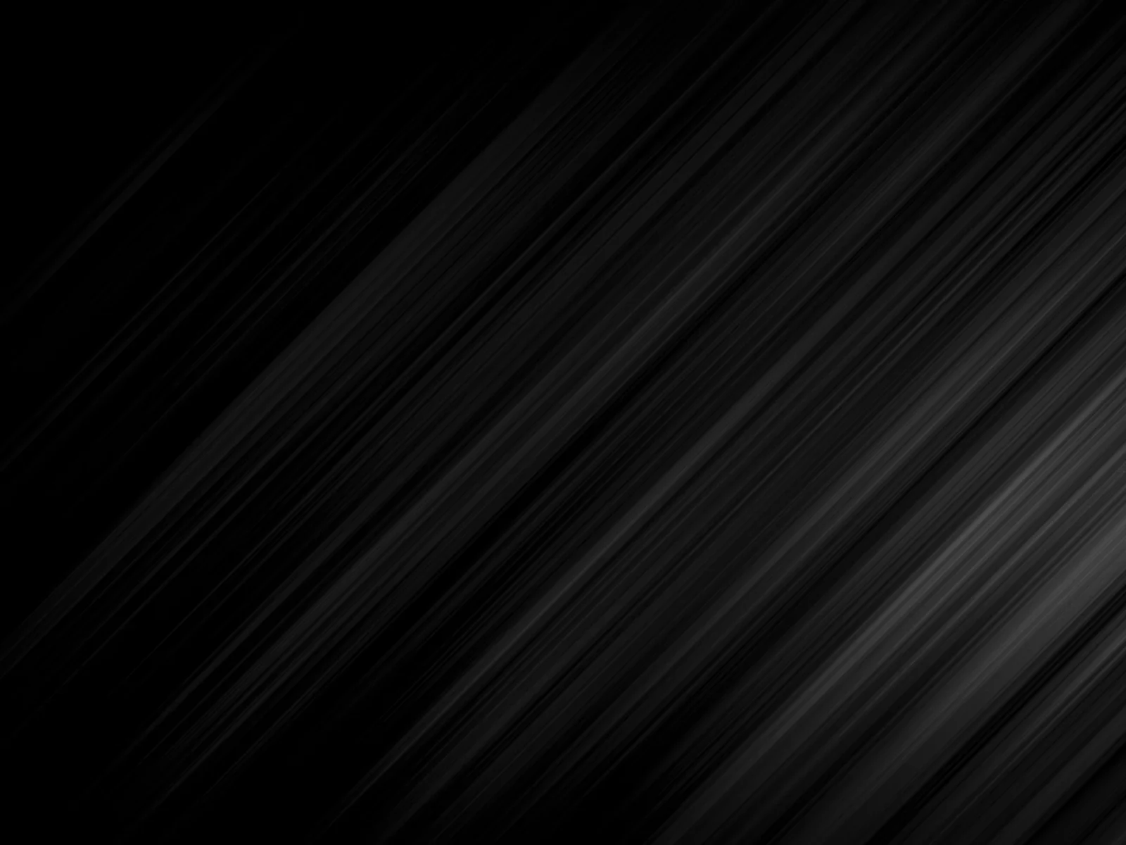 An abstract background featuring a pattern of dark gray and black diagonal lines, creating a textured, monochromatic effect.