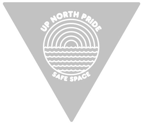 A gray triangular sticker for Up North Pride Safe Space. The logo shows stylized water waves below concentric rainbow arcs.