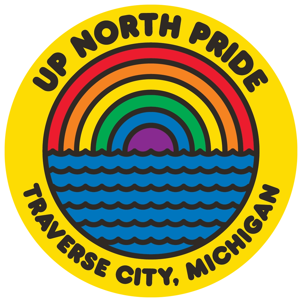 A graphic logo in a yellow circle showing a pride rainbow over blue waves. Text reads: UP NORTH PRIDE, TRAVERSE CITY, MICHIGAN.